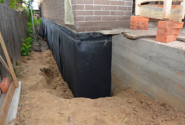 Happy homeowners after waterproofing job in McGuffey